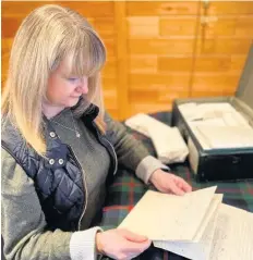  ??  ?? Historic Keren Guthrie, archivist, with the‘idiot’letter from Bonnie Prince Charlie