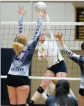  ??  ?? Monache High School's Madisyn Baxter spikes over Mission Oaks High School's defender Tuesday during the match at Monache High School.