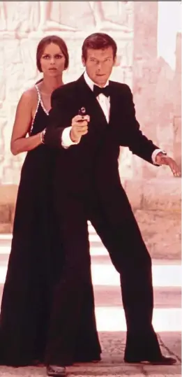  ?? .—AP ?? Moore as James Bond, and Barbara Bach as Major Anya Amasova, in 1977’s The Spy Who Loved Me