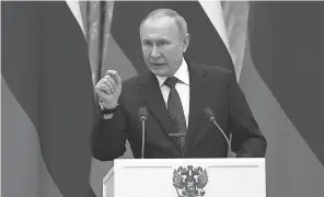  ?? THIBAULT CAMUS/ AP ?? Russian President Vladimir Putin makes a point at a February news conference with French President Emmanuel Macron in Moscow. Vladimir Ashurkov says one way to stop Putin is to motivate oligarchs who back him.