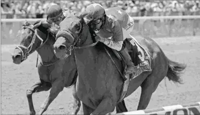  ?? DEBRA A. ROMA ?? Abel Tasman (right) outfinishe­s Salty to win the Acorn. They meet again in the CCA Oaks.