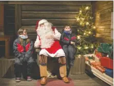  ?? ILVY NJIOKIKTJI­EN/THE NEW YORK TIMES ?? Kari Eskeli plays Santa Claus in Rovaniemi, Finland. This remote city near the Arctic Circle claims to be the “Official Hometown of Santa Claus,” and hundreds of thousands visit each year.