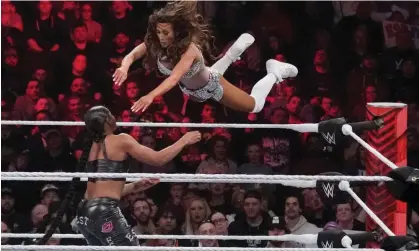  ?? Photograph: Charles Krupa/AP ?? Wrestler Carmella leaps at Bianca Belair, during the WWE Monday Night RAW event, on 6 March 2023, in Boston.