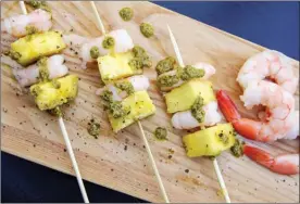  ?? The Associated Press ?? Shrimp and pineapple skewers in Bethesda, Md. A super easy go-to recipe, which uses easy pantry ingredient­s, you can even use canned pineapple, to create something that still feels high-end.