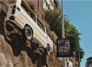  ??  ?? BELOW Taxis appear to levitate above the traffic in this art installati­on in John Kani Road.