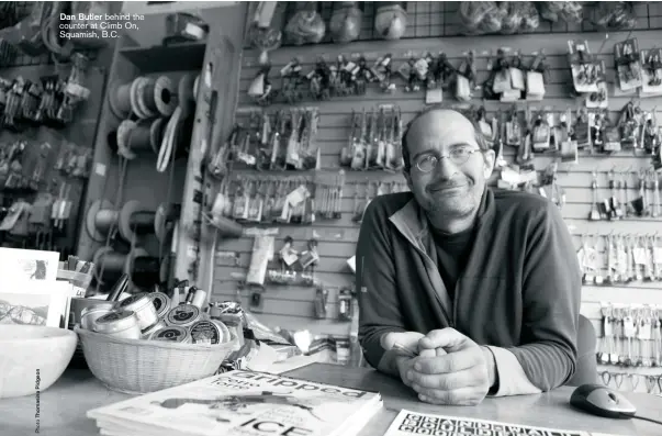  ??  ?? Dan Butler behind the counter at Climb On, Squamish, B.C.