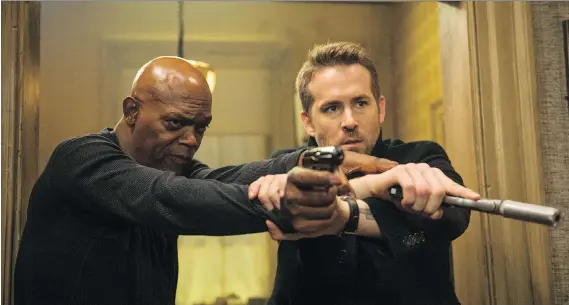  ?? JACK ENGLISH / LIONSGATE ?? Samuel L. Jackson, left, and Ryan Reynolds in The Hitman’s Bodyguard. The best part of the film might be the sing-off between the two characters.