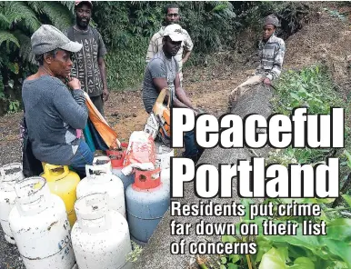  ?? RICARDO MAKYN/MULTIMEDIA PHOTO EDITOR ?? The people of Portland have listed roads and infrastruc­ture among their major concerns, and a landslide during recent heavy rain left these residents of Barry Hill stranded.