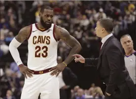  ?? AP photo ?? The Cavaliers’ LeBron James talks with coach Tyronn Lue during the second half of Cleveland’s 97-95 loss to Indiana on Friday.