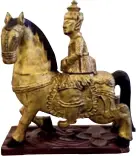  ??  ?? The gold gilded rider on a horseThis art object comes from Bagan, Myanmar, and has a concealed compartmen­t.