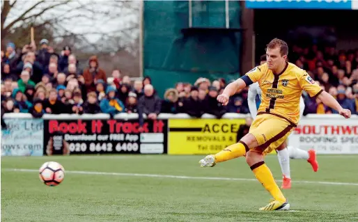  ?? AFP ?? Sutton United’s Jamie Collins scores the opening goal from the penalty spot during the English FA Cup fourth round match against Leeds United. —