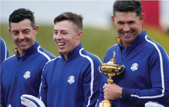  ?? ?? Team Europe captain Padraig Harrington, Team Europe's Matt Fitzpatric­k and Team Europe's Rory McIlroy pose for a team photo during a practice day at the Ryder Cup at the Whistling Straits Golf Course