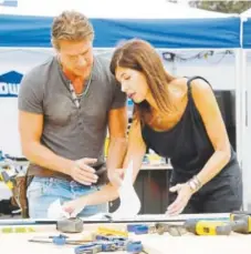  ?? Provided by HGTV ?? Designer Hildi Santo-Tomas consults with carpenter Ty Pennington on TLC's relaunched “Trading Spaces.”