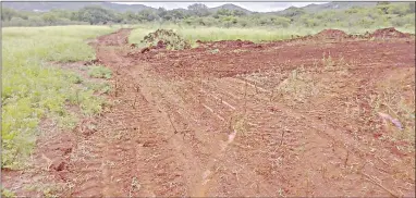  ?? (Courtesy pics) ?? The piece of land which was cleared and the residents believe the same people who are relocating them want to construct structures.