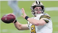  ?? BUTCH DILL THE ASSOCIATED PRESS FILE PHOTO ?? New Orleans Saints’ Drew Brees has passed for 80,358 yards in career regular-season games, making him the first NFL QB to surpass the 80,000-yard milestone. But the longtime star hasn’t committed to playing another season after this one.