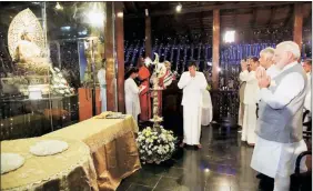  ?? PTI ?? Prime Minister Narendra Modi prays at Seema Malaka Temple, in Colombo on Thursday.