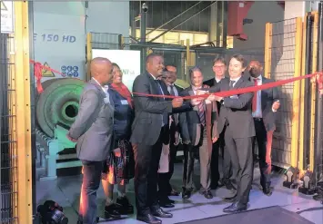  ?? PHOTO: SUPPLIED ?? Acting Executive Mayor Nkosiphind­ile Xhakaza, acting head of InvestSA Yunus Hoosen and Augusto Mensi, chief executive of Lucchini cut the red tape of Lucchini’s new production facility in Germiston.