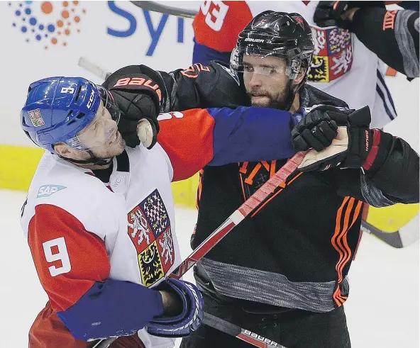  ?? — THE ASSOCIATED PRESS ?? Team North America defenceman Aaron Ekblad, right, puts a glove to the face of Team Czech Republic forward Milan Michalek during the third period of a 3-2 Czech Republic exhibition win Wednesday at Consol Energy Center in Pittsburgh.