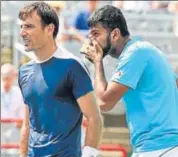  ?? GETTY IMAGES ?? Rohan Bopanna (right) and Ivan Dodig discuss strategy.