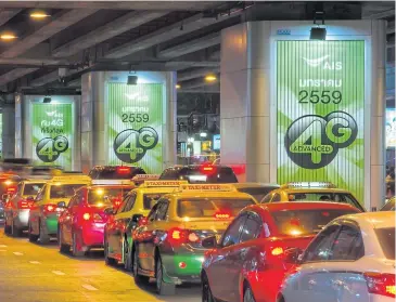  ??  ?? Maco’s street furniture advertisin­g displayed on main roads in Bangkok.