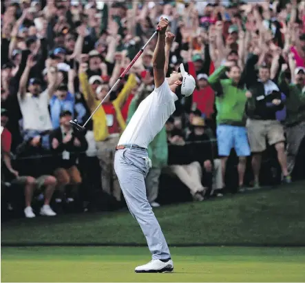  ?? DAVID J. PHILLIP/THE ASSOCIATED PRESS FILE ?? Australia’s Adam Scott celebrates after making a birdie putt on the second playoff hole to win the Masters. This was Rory McIlroy’s favourite major memory that wasn’t his own.