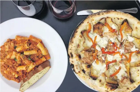  ?? — PHOTOS: ALEESHA HARRIS/PNG ?? Rigatoni bolognese and Patate e Pipi pizza from Mangia e Scappa in Fort Langley.