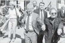  ?? ANDREW VAUGHAN THE CANADIAN PRESS ?? Dennis Oland and family members leave the courthouse in Saint John, N.B., Friday after he was found not guilty of murdering his father.