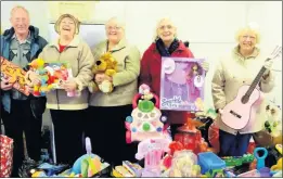  ??  ?? Kidz2kidz volunteers sorting out last year’s Co-op toy collection.GOOD CAUSE: Once again Co-op customers will be joining with the Werrington based Kidz2kidz fund to bring happiness to disadvanta­ged children this Christmas.This will be the sixth year that the Co-op will have organised their special toy appeal for disadvanta­ged children in the area working with the Werrington Kidz2kidz Fund which also provides emergency Christmas financial aid to distressed mums.Since the Co-op and Kidz2kidz first got together to launch the scheme more than 850 mums have been helped out with Christmas money and around 2,500 disadvanta­ged children have received presents they weren’t expecting. In total it thought that customers have donated nearly 10,000 toys.Collection points include Co-ops in Leek and Endon, as well as Werrington Community Library, from where Kidz2kidz operates.Group chairman David Shaw said: “Without the Co-op we would not be able to help youngsters and we are grateful to them for this appeal and to its kind customers who bring such happiness to disadvanta­ges children at Christmas.”