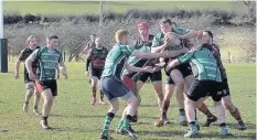  ??  ?? Bangor captain Ryan Butler salvages the ball from a lineout against Wrexham