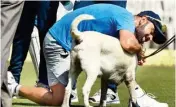  ?? PIC/PTI ?? Virat Kohli playing with sniffer dog during a practice session ahead of the fifth and final Test against England in Chennai on Thursday