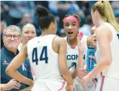  ?? CLOE POISSON/SPECIAL TO THE COURANT ?? Uconn head coach Geno Auriemma glances at the scoreboard while drawing up a play for his team late in the second half against Villanova on Sunday at the XL Center in Hartford.