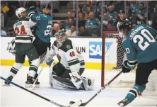  ?? Ben Margot / Associated Press ?? San Jose’s Marcus Sorensen scores against Minnesota goalie Devan Dubnyk during the first period of the Sharks’ win.