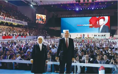 ?? (Umit Bektas/Reuters) ?? TURKISH PRESIDENT Tayyip Erdogan, accompanie­d by his wife Emine, greets his supporters during the sixth Congress of the ruling AK Party in Ankara yesterday.