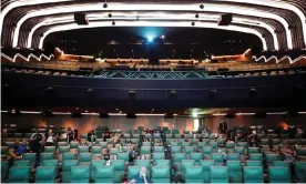  ?? Photograph: Henry Nicholls/Reuters ?? People take their seats inside the Odeon Luxe Leicester Square cinema on the opening day of the film Tenet in London.