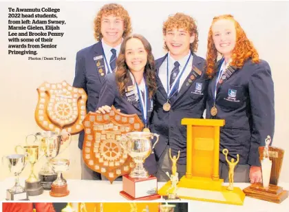  ?? Photos / Dean Taylor ?? Te Awamutu College 2022 head students, from left: Adam Swney, Marnie Gielen, Elijah Lee and Brooke Penny with some of their awards from Senior Prizegivin­g.