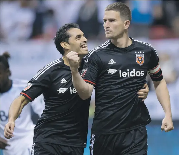  ?? — CP FILES ?? Fabian Espindola, left, pictured with D.C. United’s Bobby Boswell, is headed west after the Vancouver Whitecaps acquired the forward from D.C. for allocation money. The 31-year-old has spent a decade in MLS with stops in Salt Lake City, New York and...