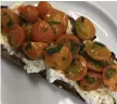  ?? PHOTO COURTESY MARY ANN ESPOSITO ?? SIMPLE PLEASURES: For an easy bruschetta, top a slice of good bread with ricotta and cherry tomatoes.