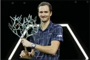  ?? CHRISTOPHE ENA — THE ASSOCIATED PRESS ?? Russia’s Daniil Medvedev holds his trophy after the Paris Masters tennis tournament final, Sunday, Nov. 8, 2020 in Paris. Daniil Medvedev won the Paris Masters for the first time by beating Germany’s Alexander Zverev 5-7, 6-4, 6-1 on Sunday for his eighth career title and third at a Masters event.