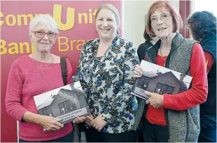  ??  ?? Below right: At the Trafalgar Railway Station opening, VicTrack community building program manager Jean Parson (centre) hands out commemorat­ive books to Ingrid Thomas and Sue Murphy.