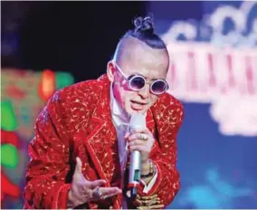 ??  ?? This picture shows Mongolian rapper Amarmandak­h Sukhbaatar performing in Ulan Bator. — AFP