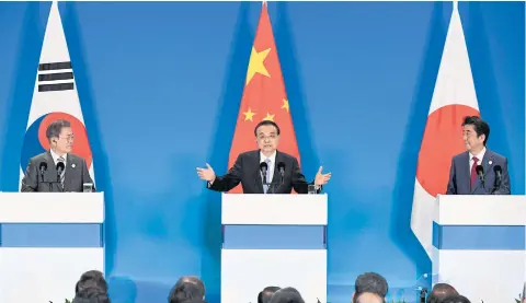  ?? AFP ?? China’s Premier Li Keqiang, centre, speaks at the 8th trilateral leaders’ meeting between China, South Korea and Japan in Chengdu yesterday.