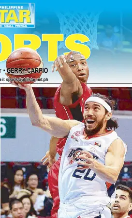  ?? JUN MENDOZA ?? Jared Dillinger of Meralco goes for a basket under the stretched arms of James White of Mahindra in last night’s PBA game at the MOA Arena.