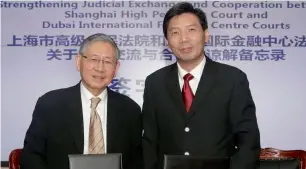  ?? Supplied photos ?? Michael Hwang and Sheng Yongqiang at an event for signing a memorandum of understand­ing on strengthen­ing judicial exchange and cooperatio­n between Shanghai High People’s Court and Dubai Internatio­nal Financial Centre Courts. —