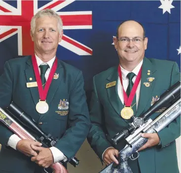  ?? Picture: ANNA ROGERS ?? CHAMPS: Cairns Rifle Club members Peter Carter and Marty Lobert were in the national team that won the world F Open title for long range rifle shooting using telescopic sights.