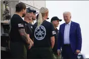  ?? EVAN VUCCI — THE ASSOCIATED PRESS FILE ?? President Joe Biden greets firefighte­rs as he tours the National Interagenc­y Fire Center in Boise, Idaho.