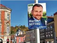  ??  ?? Ein Wahlplakat von Martin Mittag (CSU) hängt in den Straßen von Coburg. Foto: Martin Debes