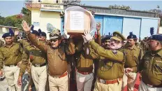  ?? PTI ?? DGP Gupteshwar Pandey and police personal carry the coffin of slain CRPF jawan Ratan Thakur in Patna yesterday.