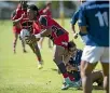  ?? VIRGINIA WOOLF/STUFF ?? Waimea Old Boys’ Mo Tau is tackled by Nelson’s Kim Bateman.