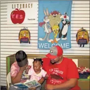  ?? / Contribute­d ?? Parents and local youth read to one another during the YWTSA’s Literacy Day on May 19.