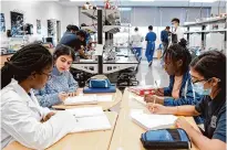  ?? Leanora Benkato/Contributo­r file photo ?? Students review notes in November 2022 at DeBakey High School for Health Profession­s.